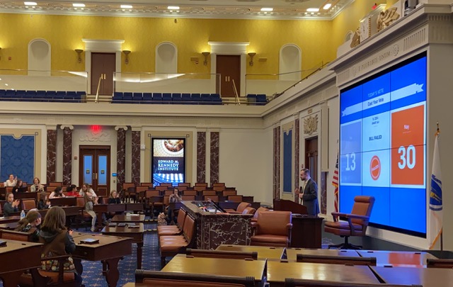 Girl Scouts participating in workshops and convening to vote on a data privacy draft bill in a full-scale replica of the US Senate Chamber.