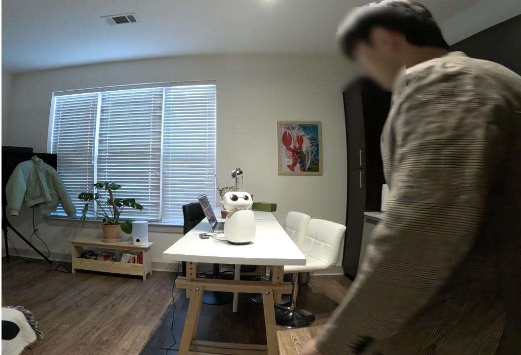 Reachy Mini robot platform in a home-style environment.